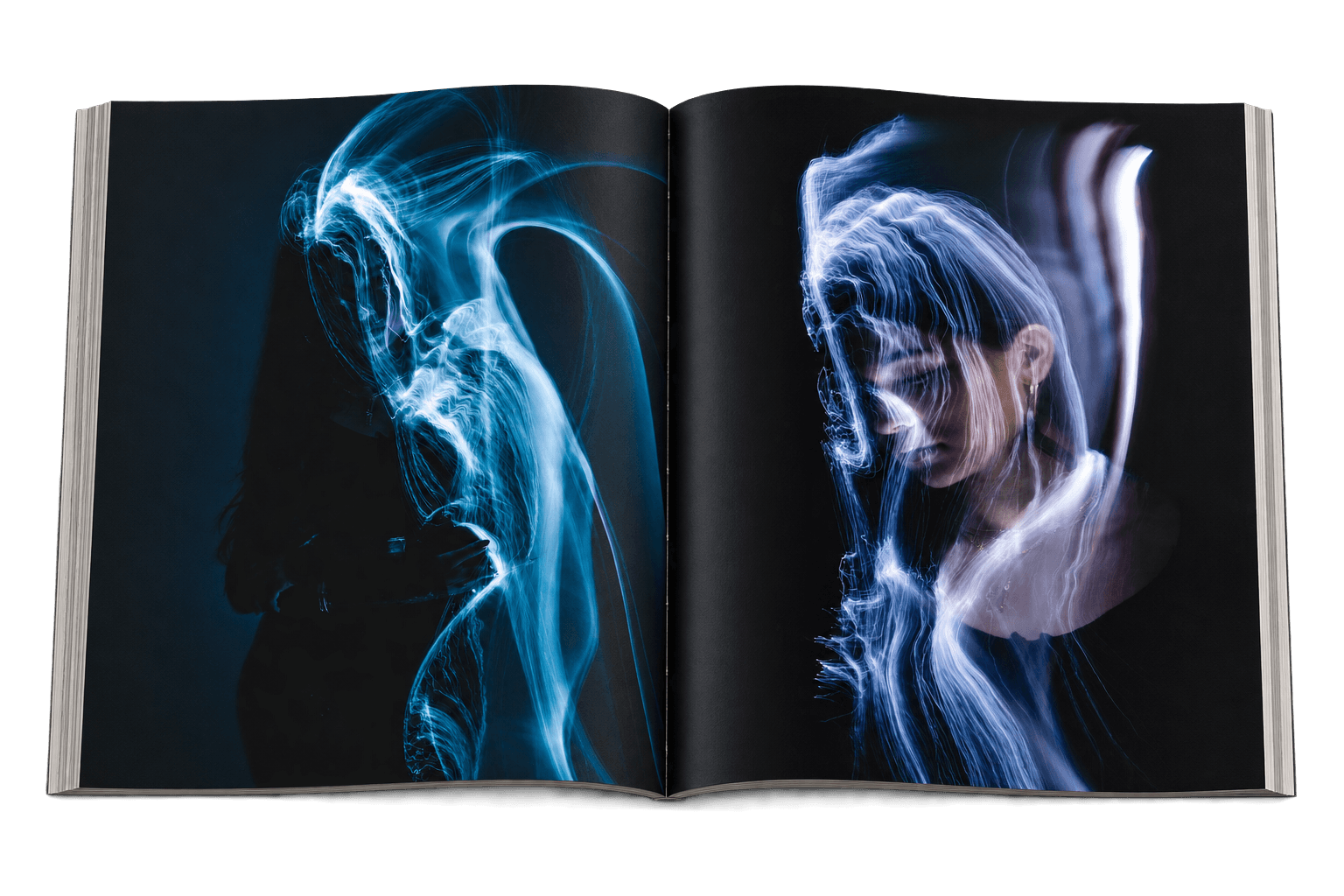 Open magazine with two light-painting portraits photographed by Sara Schultz